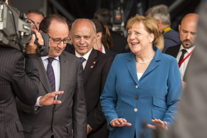 2016-06-01 11:51:52 epa05340591 (L-R) French President Francois Hollande, Swiss federal Councillor Ueli Maurer and German Chancellor Angela Merkel during the opening day of the Gotthard rail tunnel, the longest tunnel in the world, at the southern portal in Pollegio, Switzerland, 01 June 2016. The construction of the 57 kilometer long tunnel began in 1999, the breakthrough was in 2010. After the official opening on 01 June, the commercial opperation will commence in December 2016. EPA/ALEXANDRA WEY
