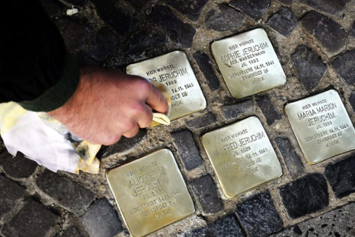 epa02997410 Members of the Jewish student association 'Studentim' polish a set of 'Stolpersteine', or 'Stumbling Stones', as part of an initiative to commemorate the Night of Broken Glass in Berlin, Germany, 09 November 2011. The 'Stumbling Stones' are placed in front of houses where formerly Jewish residents used to live and feature an engraved metal surface which displays the names, dates and places of death of Jewish residents who were murdered by the Nazi regime. This initiative alludes to the anniversary of the Night of Broken Glass, or 'Kristallnacht', which took place on 09 November 1938. EPA/TILMAN VOGLER