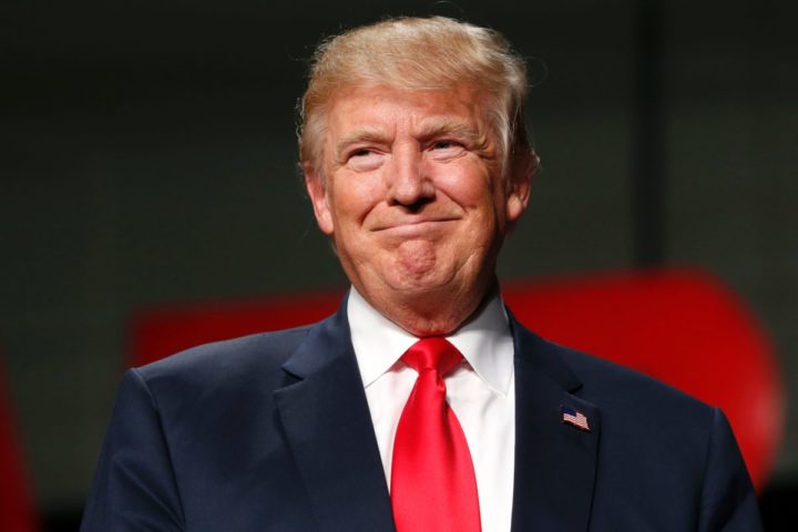 2016-10-31 17:37:01 US Republican Presidential nominee Donald Trump addresses supporters at Macomb Community College on October 31, 2016 in Warren, Michigan. Donald Trump and Hillary Clinton traded fierce campaign trail attacks Monday, as the Republican underdog barnstormed Democratic territory in the race's final week and warned of a "constitutional crisis" should his rival win the White House. / AFP PHOTO / JEFF KOWALSKY
